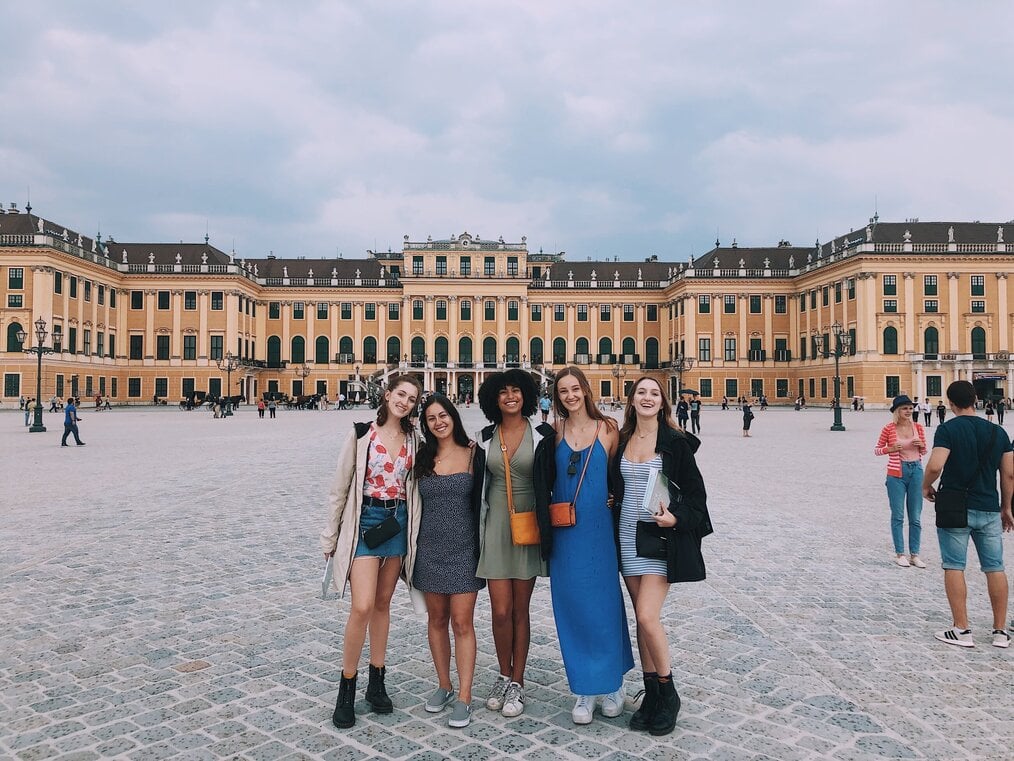 Five women standing in front of a large building in Berlin, Germany.